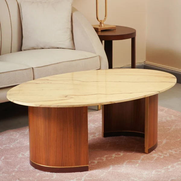 Khawaj Sajjad 2-Seater Sofa in beige with an oval marble coffee table on a wooden base, placed on a pink rug in a chic, warm living room.
